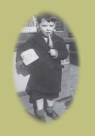 An Image of a Little Boy Eating a Toffee Carrot in 1940