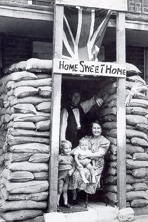 An Image of a Family Under a 'Home Sweet Home' Sign